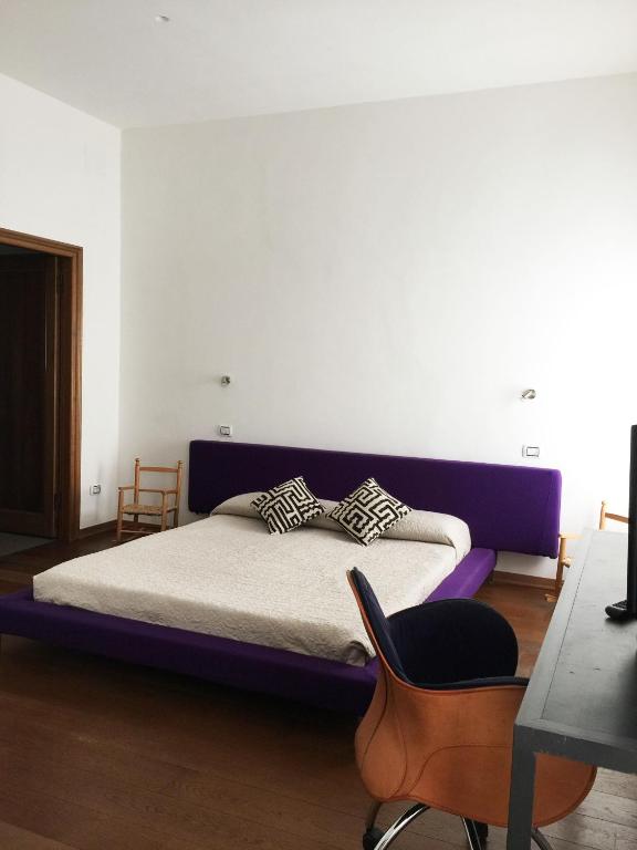 Posteľ alebo postele v izbe v ubytovaní Uma Apartments