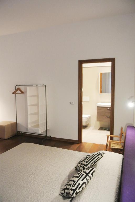Posteľ alebo postele v izbe v ubytovaní Uma Apartments
