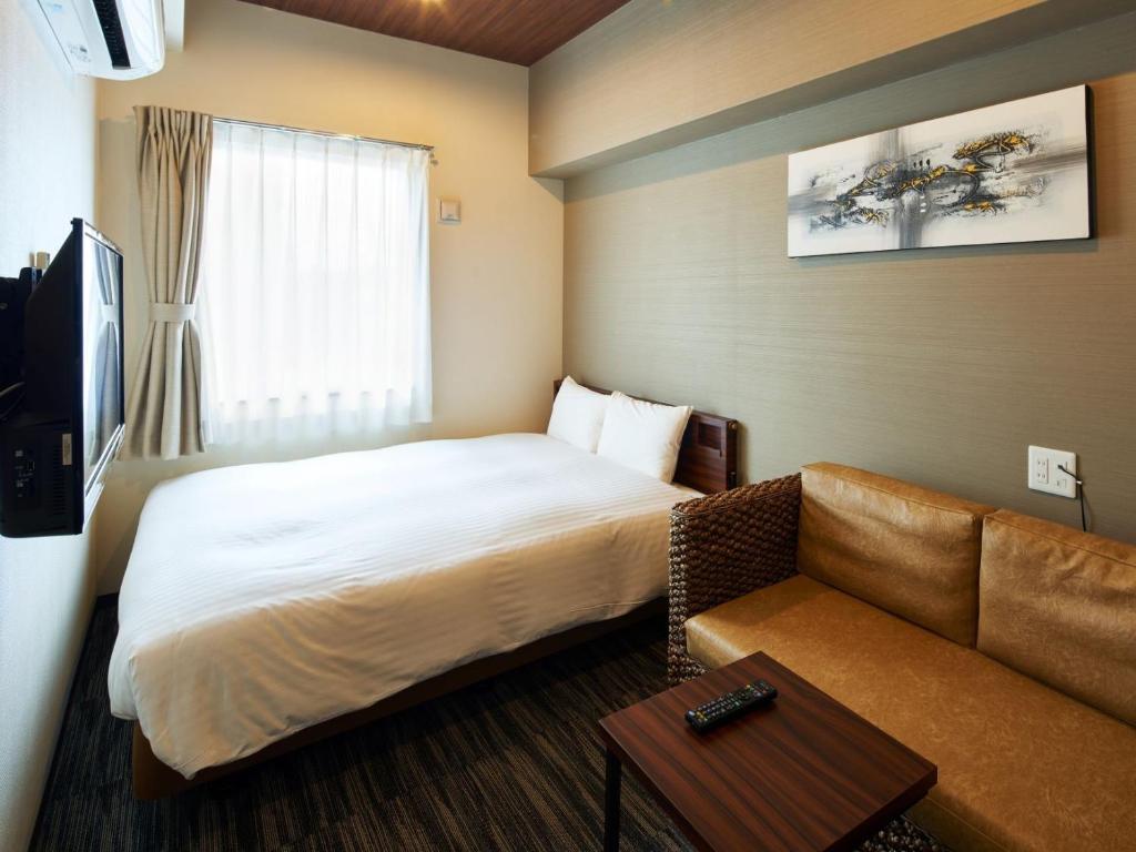 Gulta vai gultas numurā naktsmītnē One's Hotel Fukuoka
