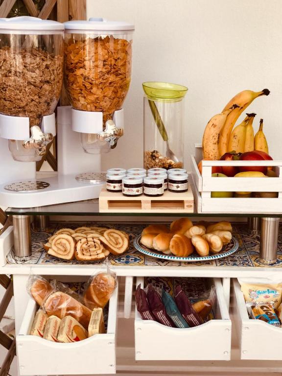 a shelf filled with lots of different types of food at Villa Pollio Guest House in Anacapri