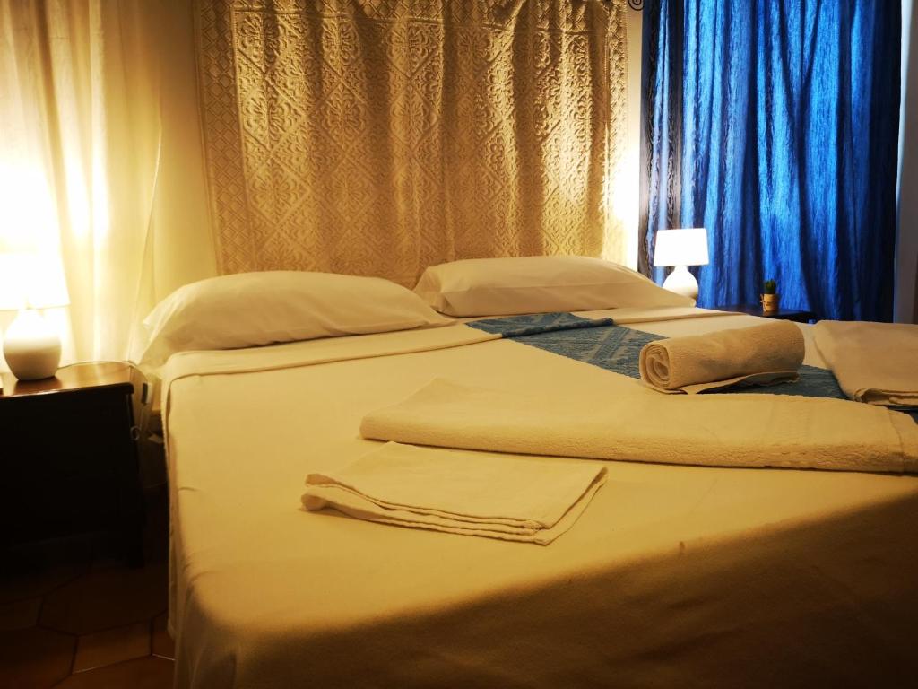Postel nebo postele na pokoji v ubytování Antonhouse Alghero