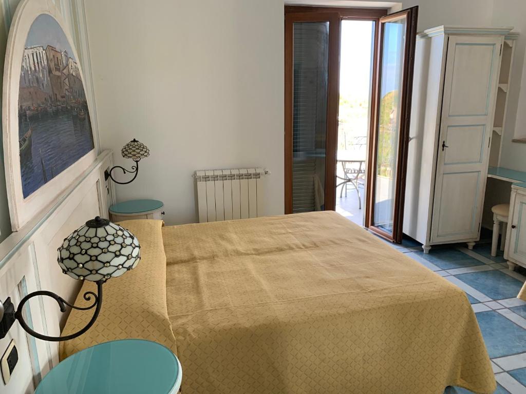 Postel nebo postele na pokoji v ubytování Hotel Isolabella