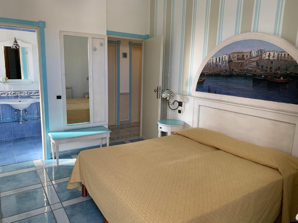 Postel nebo postele na pokoji v ubytování Hotel Isolabella