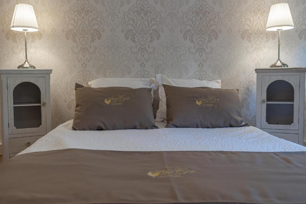 Postel nebo postele na pokoji v ubytování Hôtel Au Coq Dort Spa