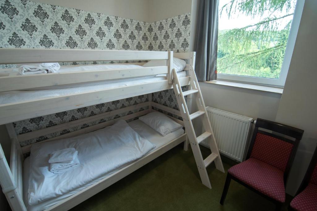 Posteľ alebo postele v izbe v ubytovaní 4family *RESORT*SPA*