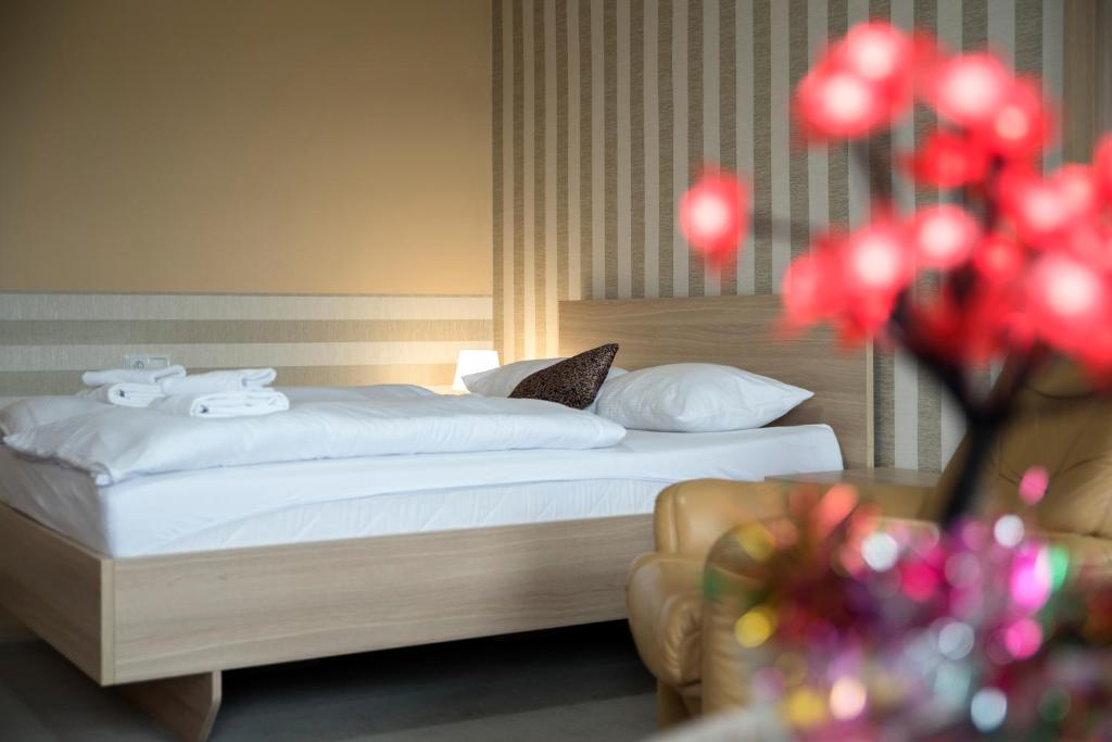 Posteľ alebo postele v izbe v ubytovaní 4family *RESORT*SPA*