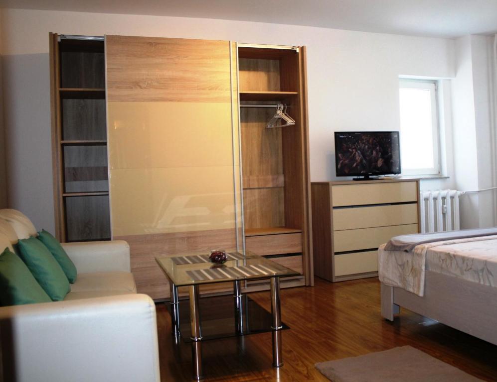 a living room with a couch and a table at Alba Iulia square, Premium studio 2 in Bucharest