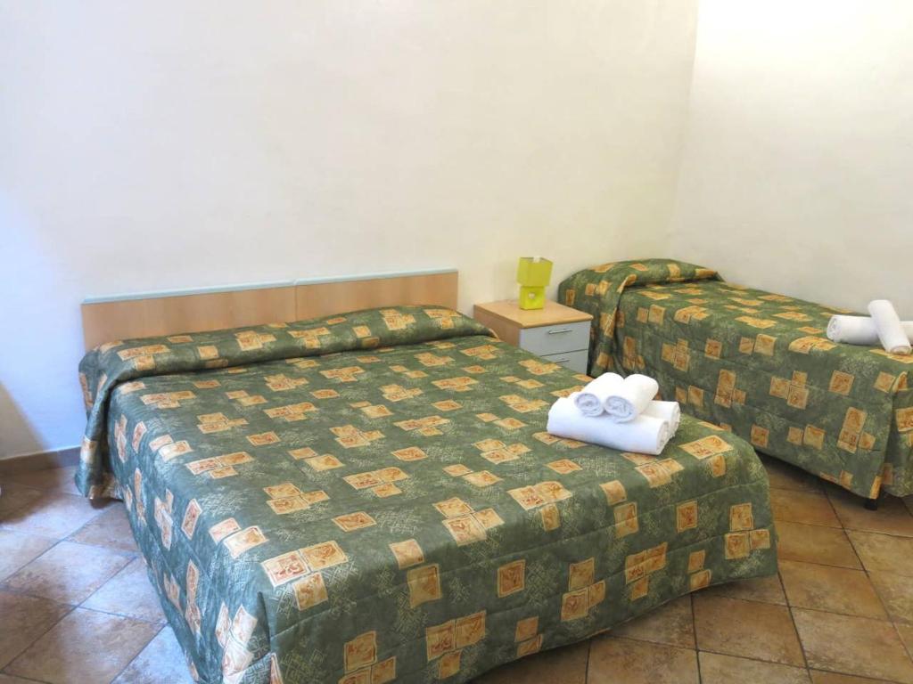 Postel nebo postele na pokoji v ubytování HostelCiompi