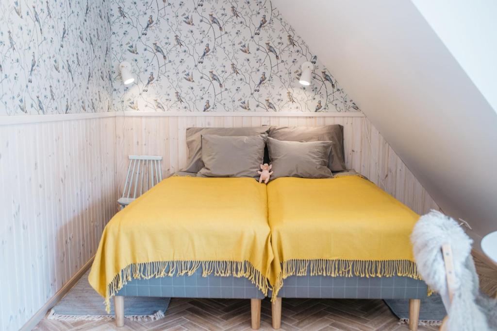 Postel nebo postele na pokoji v ubytování KaksTeist Apartments
