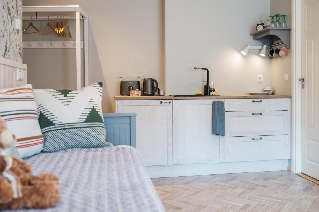 Kuchyň nebo kuchyňský kout v ubytování KaksTeist Apartments