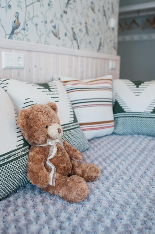 Postel nebo postele na pokoji v ubytování KaksTeist Apartments