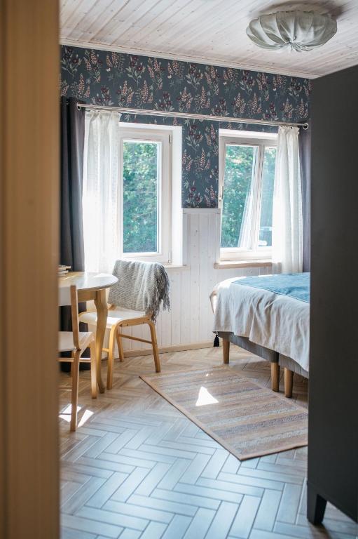 Postel nebo postele na pokoji v ubytování KaksTeist Apartments
