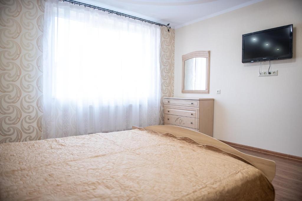 Postel nebo postele na pokoji v ubytování Затишна оселя