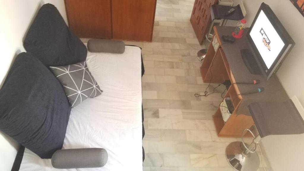 Televízia a/alebo spoločenská miestnosť v ubytovaní Casa Casergyo