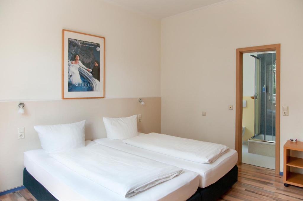 Postel nebo postele na pokoji v ubytování Hotel Weidenhof