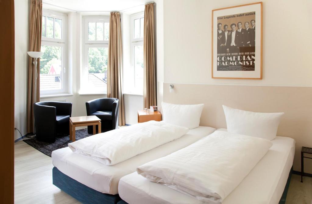 Postel nebo postele na pokoji v ubytování Hotel Weidenhof