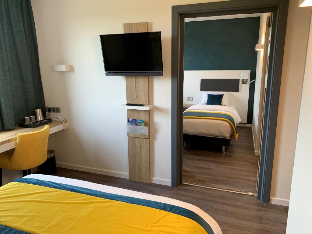 Postel nebo postele na pokoji v ubytování ATOLON PARK HOTEL