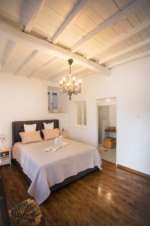 Postel nebo postele na pokoji v ubytování Rodia House