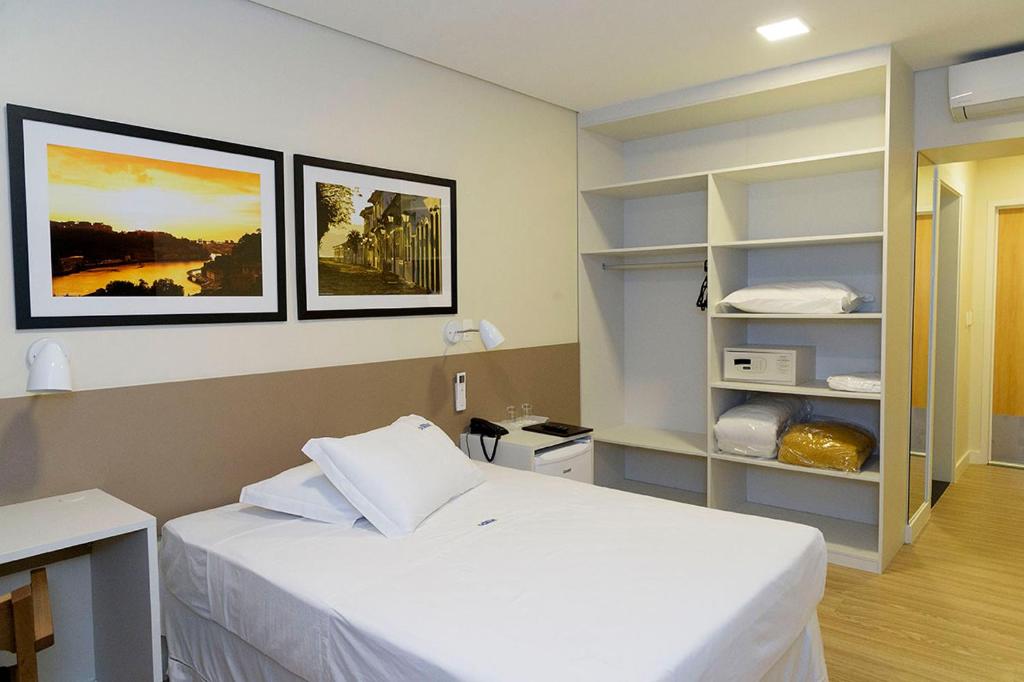 מיטה או מיטות בחדר ב-Hotel Domani
