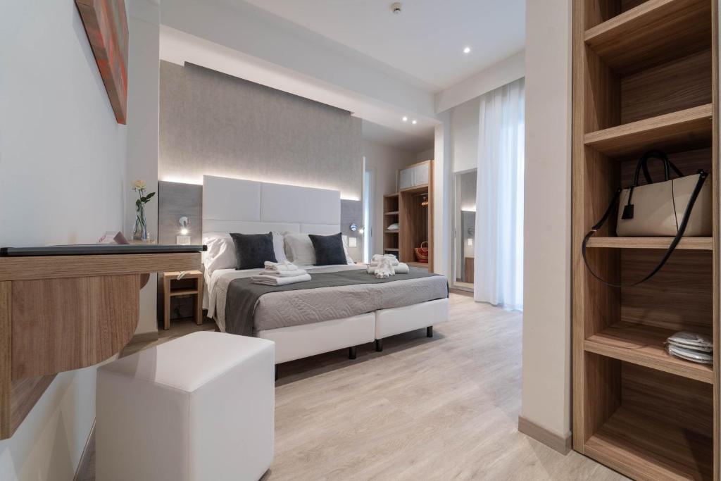 Postel nebo postele na pokoji v ubytování Hotel Reggiana