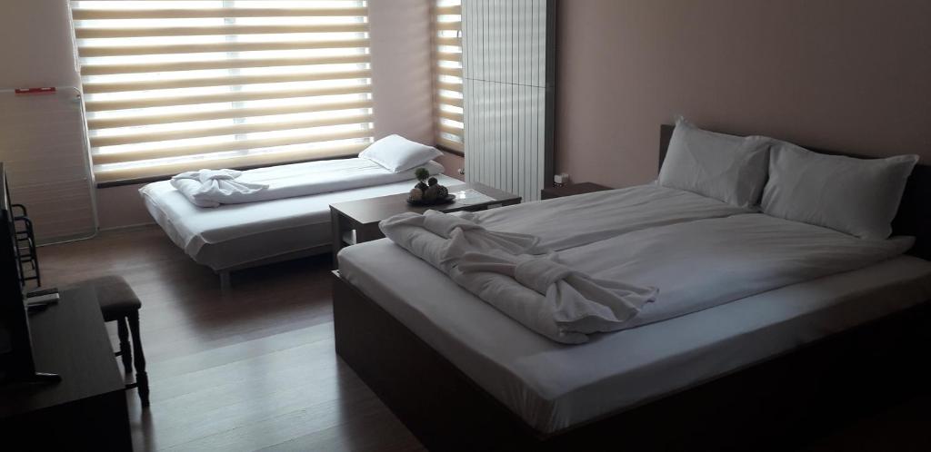 Postel nebo postele na pokoji v ubytování Guest House Ideal