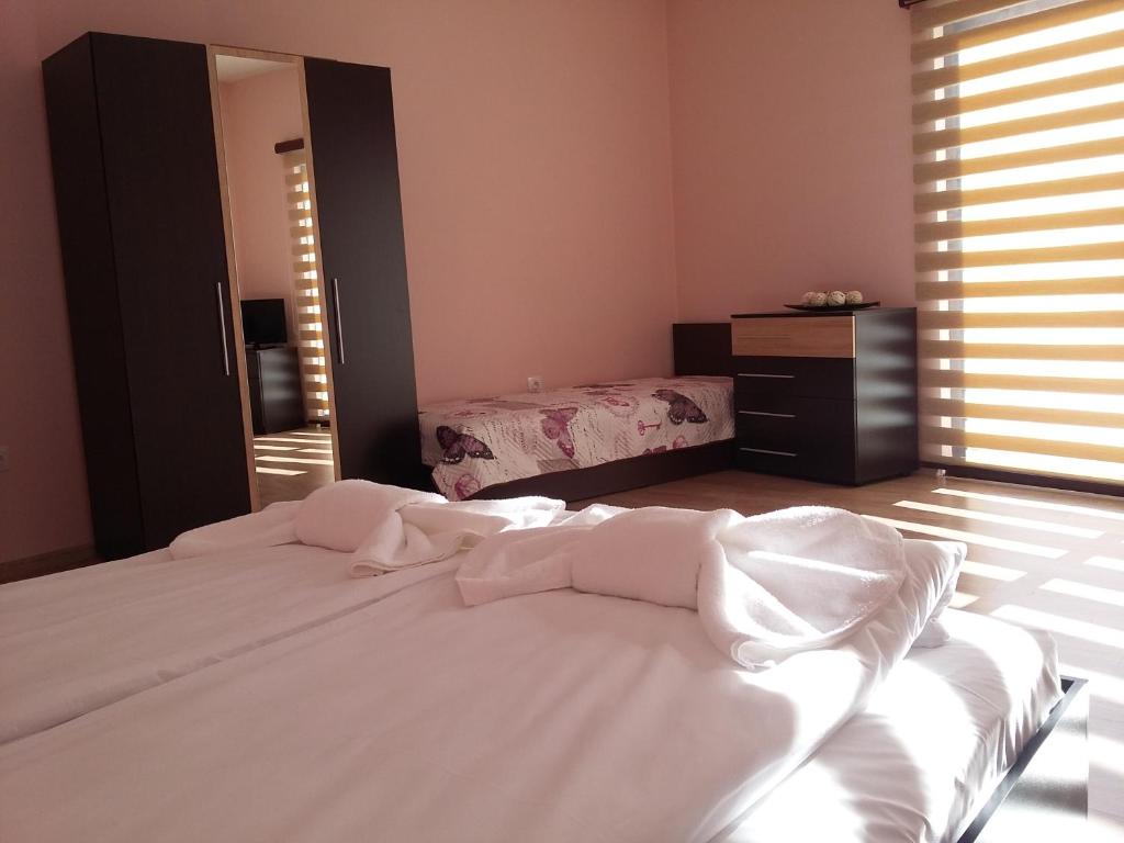 Postel nebo postele na pokoji v ubytování Guest House Ideal