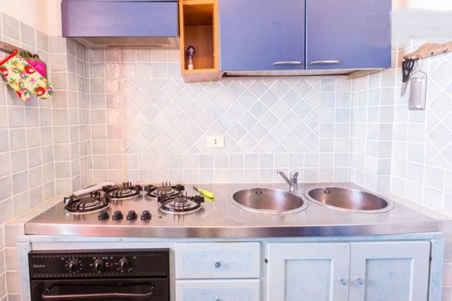 A kitchen or kitchenette at On The Beach La Rena Beddha