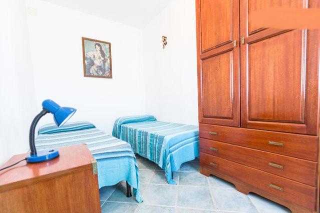 A bed or beds in a room at On The Beach La Rena Beddha