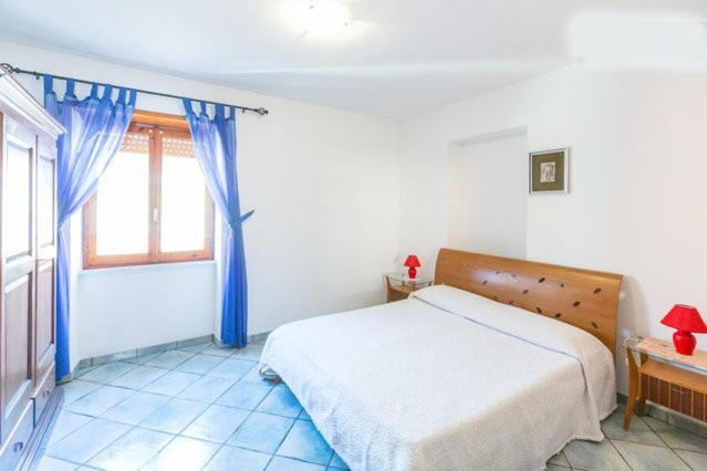 A bed or beds in a room at On The Beach La Rena Beddha