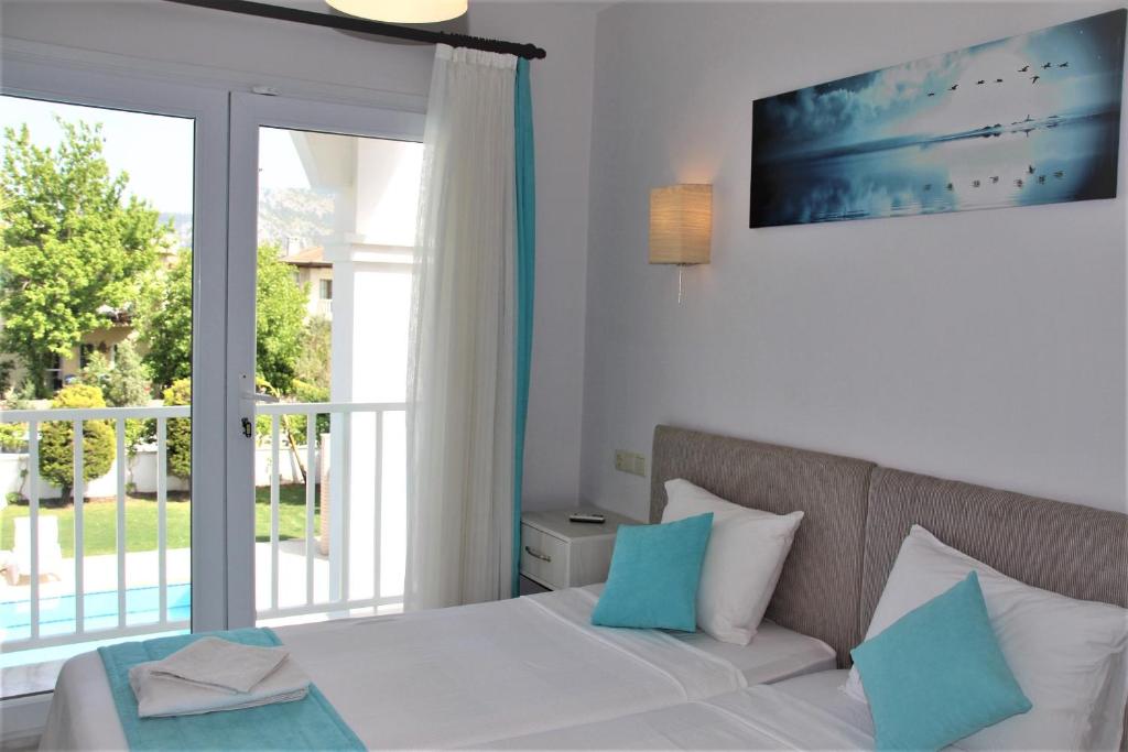 Postel nebo postele na pokoji v ubytování Dalyan Villa Amazon