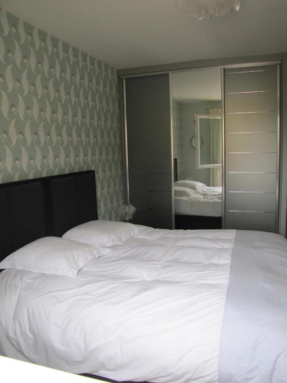 Postel nebo postele na pokoji v ubytování L'Appartement
