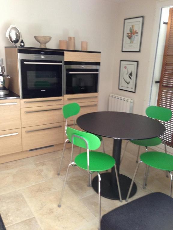 Kuchyň nebo kuchyňský kout v ubytování L'Appartement