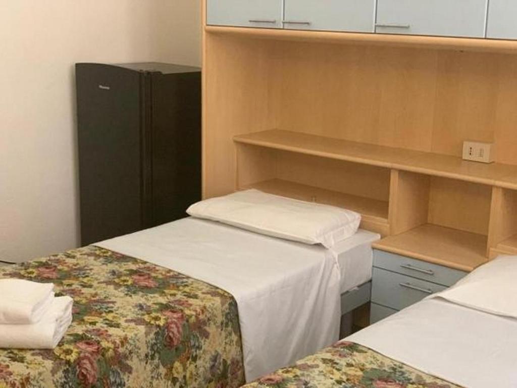 Postel nebo postele na pokoji v ubytování HostelCiompi