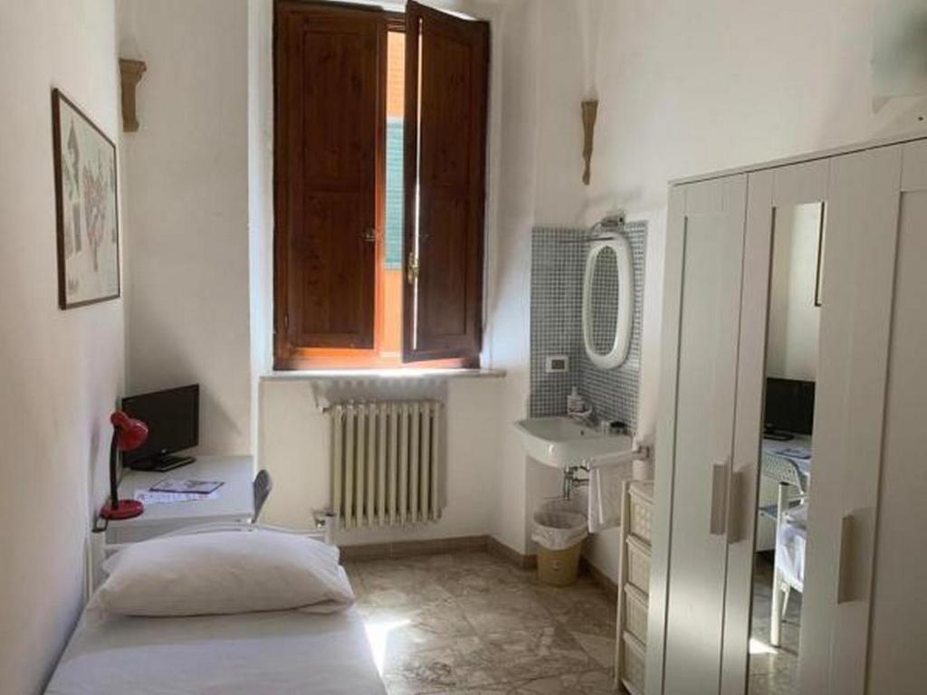 Postel nebo postele na pokoji v ubytování HostelCiompi
