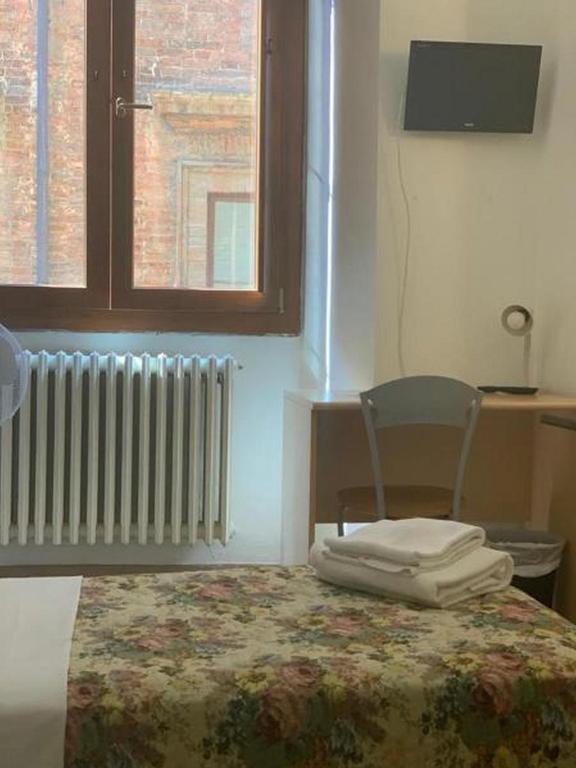 Postel nebo postele na pokoji v ubytování HostelCiompi