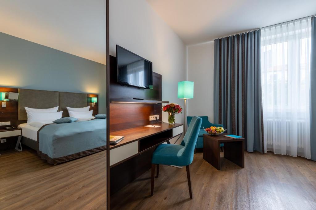 Cama ou camas em um quarto em Trip Inn Hotel Messe Westend