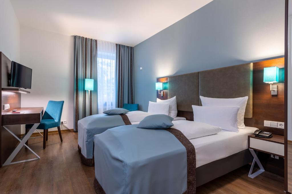 Cama ou camas em um quarto em Trip Inn Hotel Messe Westend