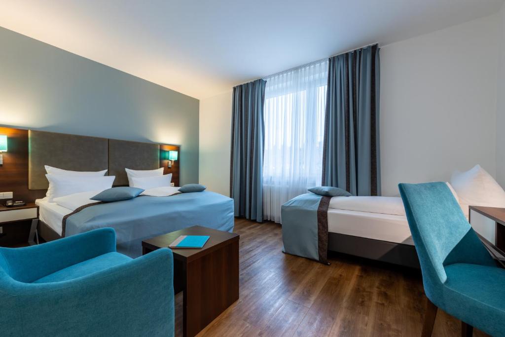 Cama ou camas em um quarto em Trip Inn Hotel Messe Westend