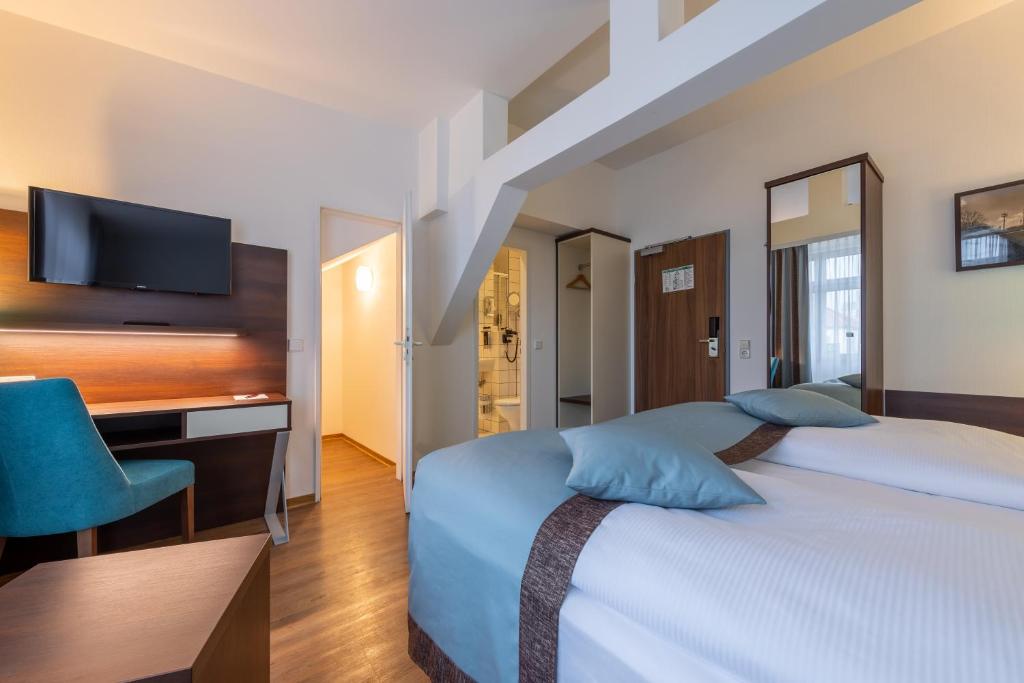 Cama ou camas em um quarto em Trip Inn Hotel Messe Westend