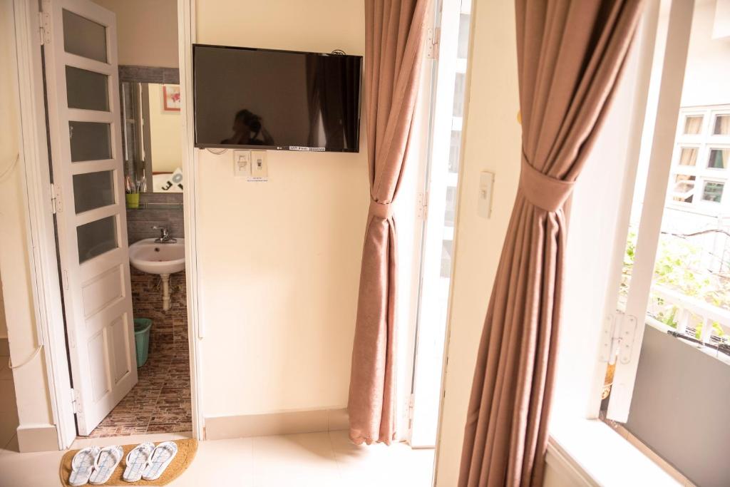 TV a/nebo společenská místnost v ubytování Minh Tam Guesthouse