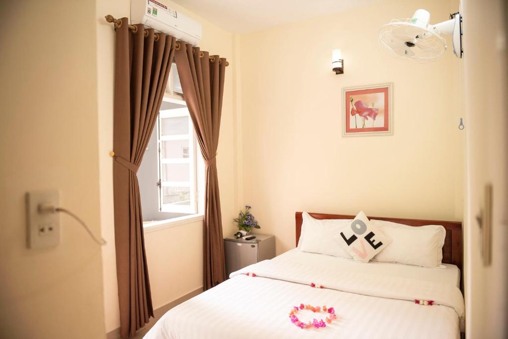 Postel nebo postele na pokoji v ubytování Minh Tam Guesthouse