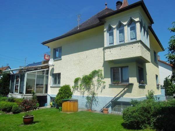 a large house with a lawn in front of it at Ferienwohnung Nissle in Isny im Allgäu