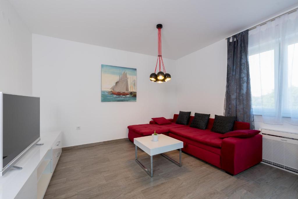 Televízia a/alebo spoločenská miestnosť v ubytovaní Villa Anja 1st floor