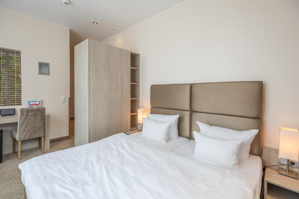 Postel nebo postele na pokoji v ubytování Thomas Hotel Spa & Lifestyle