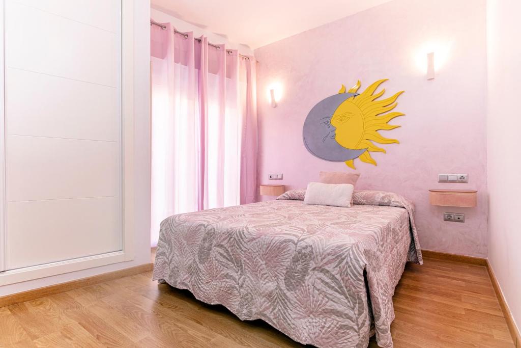 Posteľ alebo postele v izbe v ubytovaní Apartamentos Momas La Casa De Mamá
