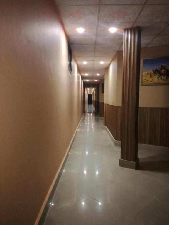 a hallway of a building with a long hallwayngth at Hotel City View Peshawar in Peshawar