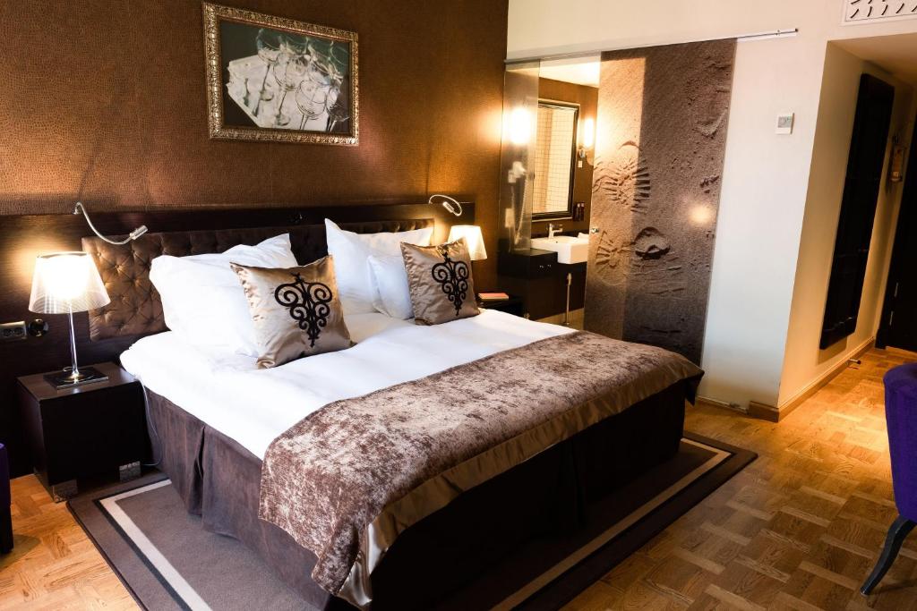 Postel nebo postele na pokoji v ubytování Home Hotel Havnekontoret