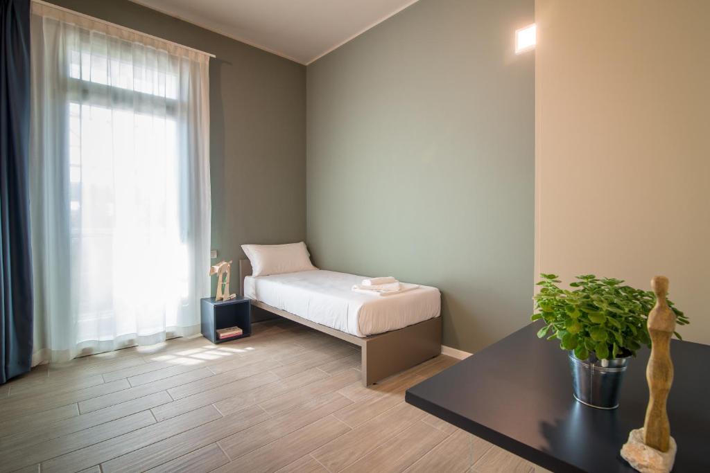 Postel nebo postele na pokoji v ubytování Casa a Colori Padova