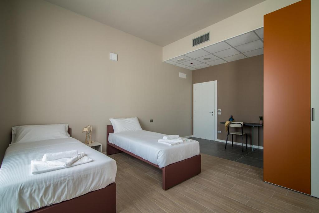 Postel nebo postele na pokoji v ubytování Casa a Colori Padova