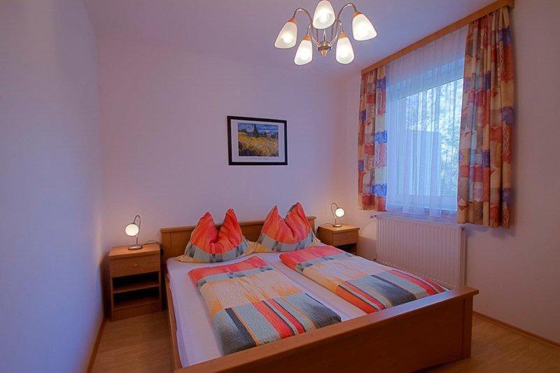 Postel nebo postele na pokoji v ubytování Haus am Wald